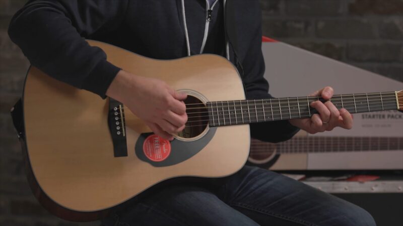 Acoustic Guitar with a strap